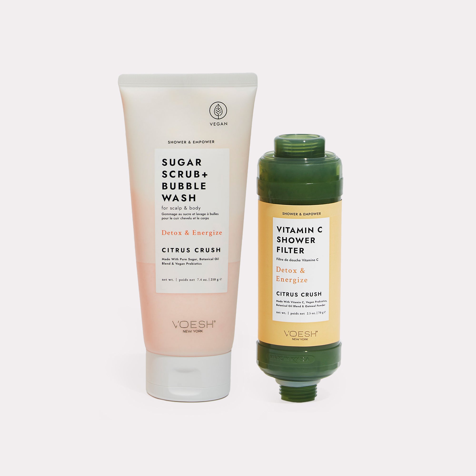 Citrus Crush Shower & Empower Duo - Sugar scrub and shower filter on gray background
